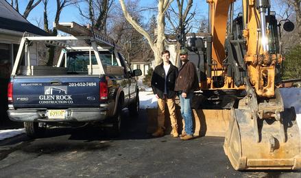 Owner Glenn Sternitzke and his son Jack standing next to the Glen Rock Construction truck
